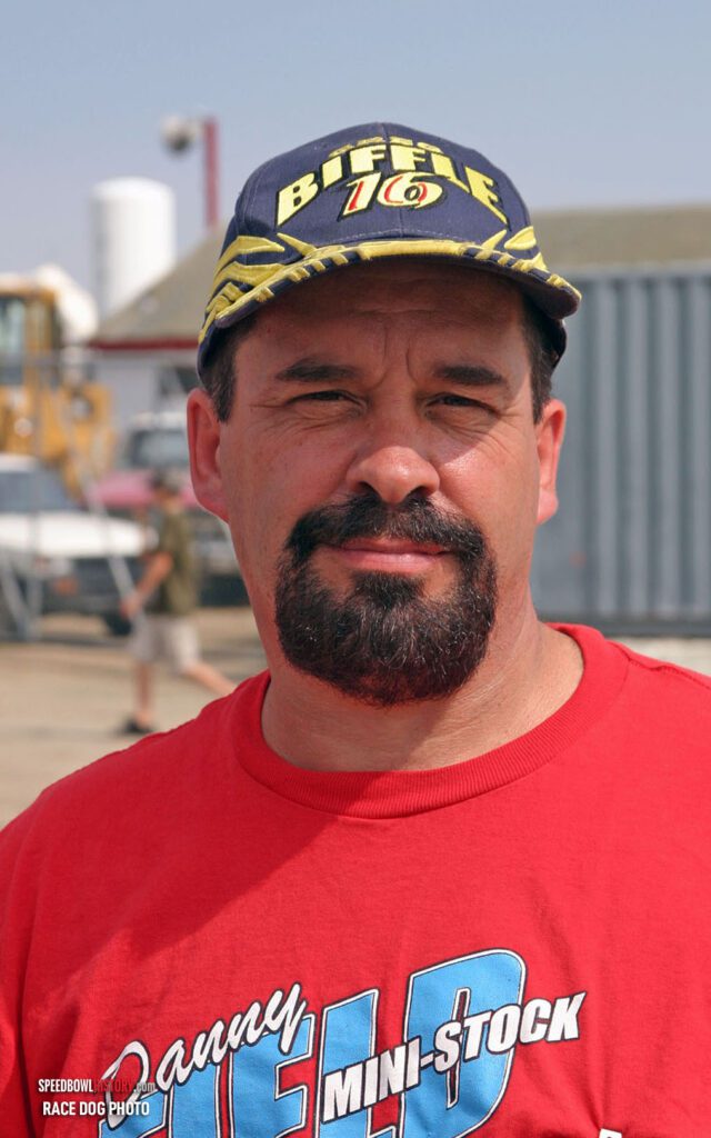 Black and white abstract pattern with concentric circles and wave shapes.