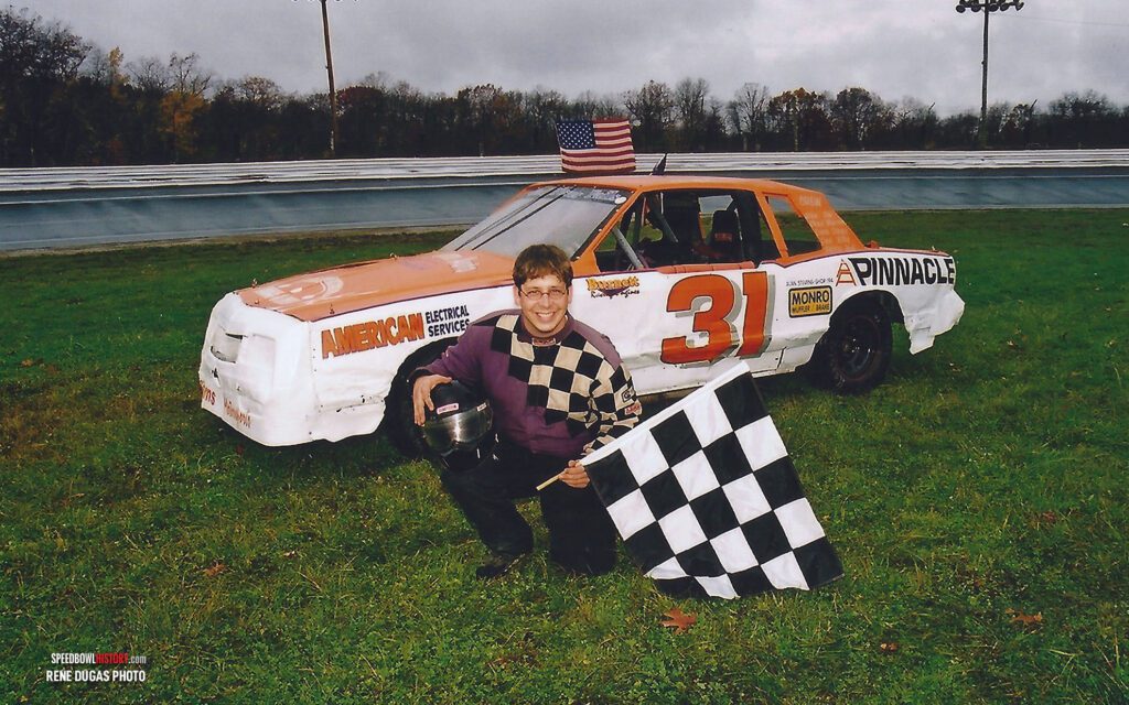 Black and white abstract pattern with concentric circles and wave shapes.