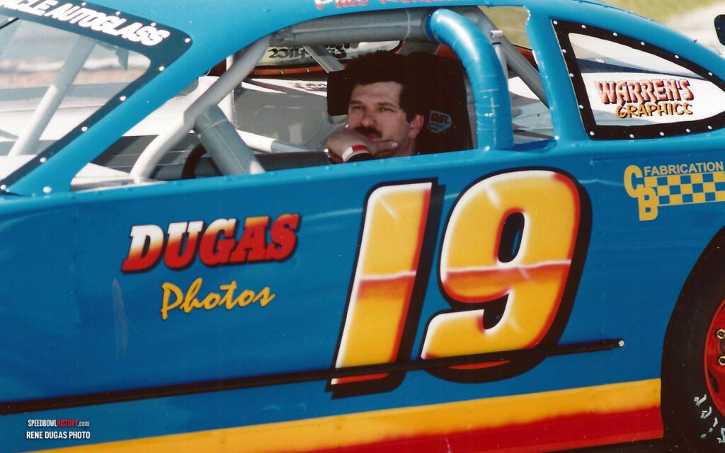 Black and white abstract pattern with concentric circles and wave shapes.