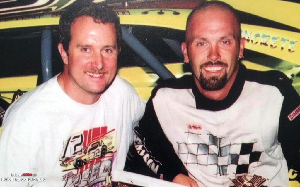 Black and white abstract pattern with concentric circles and wave shapes.