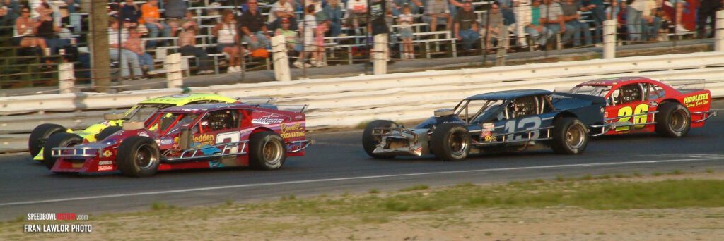 Black and white abstract pattern with concentric circles and wave shapes.