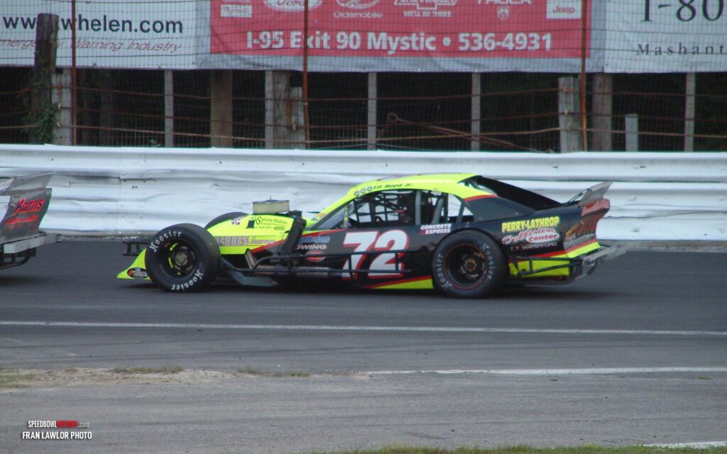 Black and white abstract pattern with concentric circles and wave shapes.