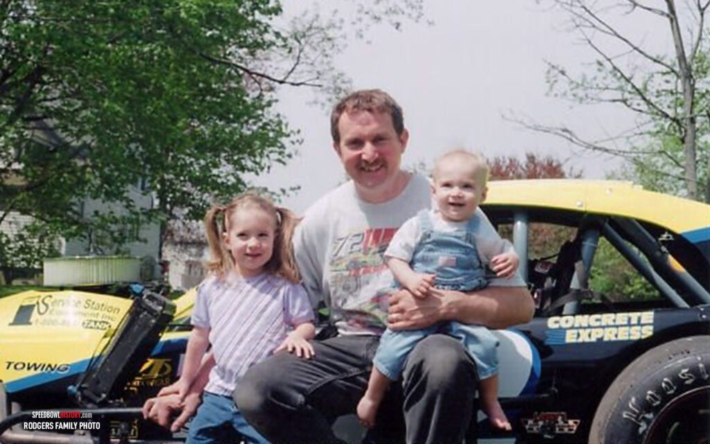 Black and white abstract pattern with concentric circles and wave shapes.