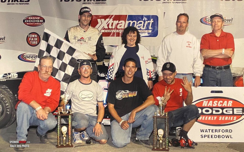 Black and white abstract pattern with concentric circles and wave shapes.