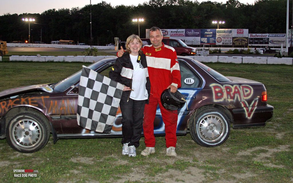 Black and white abstract pattern with concentric circles and wave shapes.