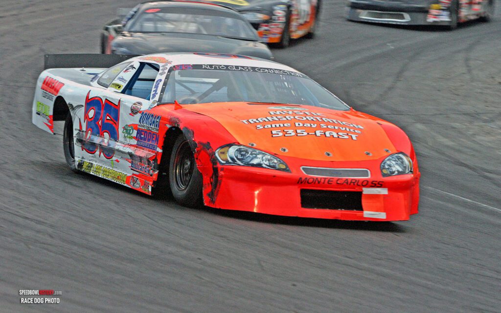 Black and white abstract pattern with concentric circles and wave shapes.