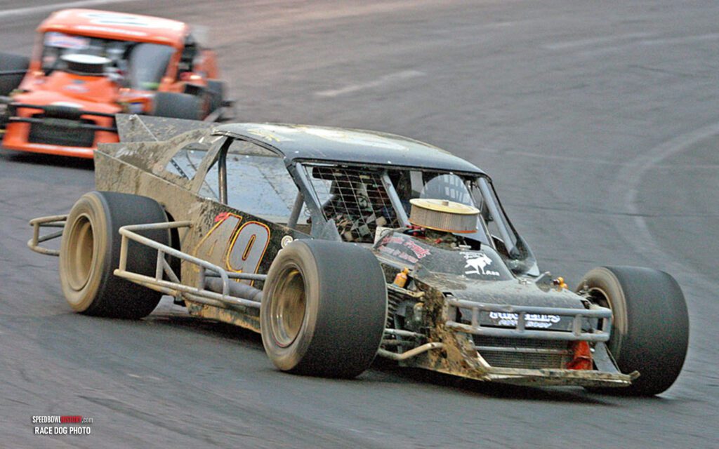 Black and white abstract pattern with concentric circles and wave shapes.