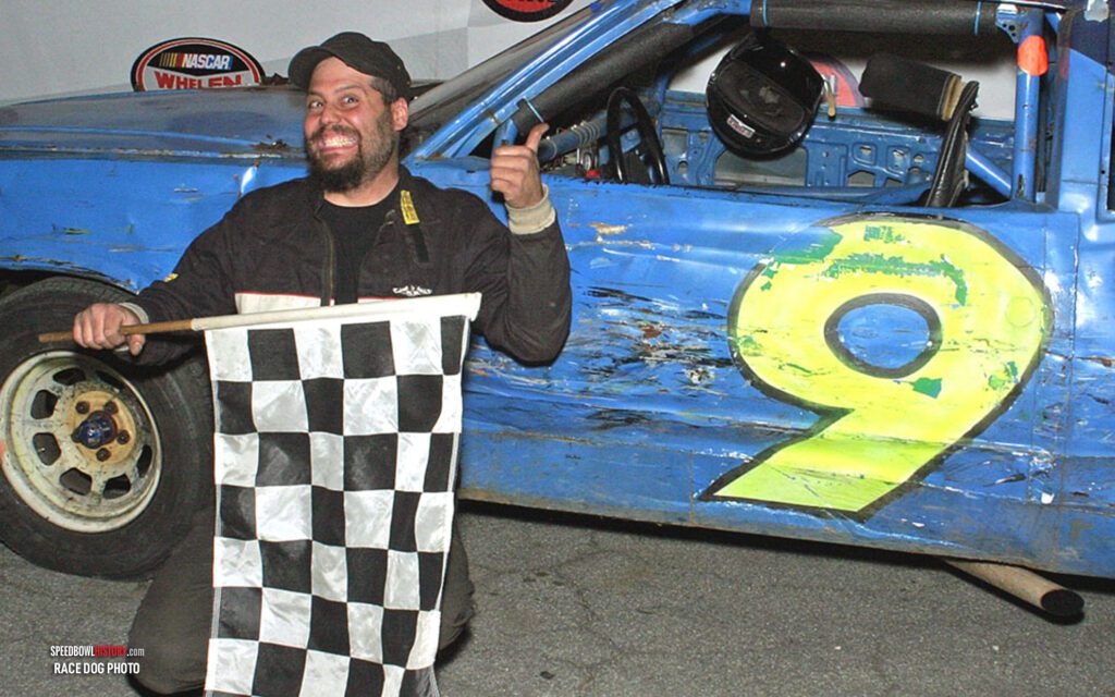 Black and white abstract pattern with concentric circles and wave shapes.