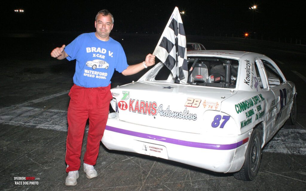 Black and white abstract pattern with concentric circles and wave shapes.