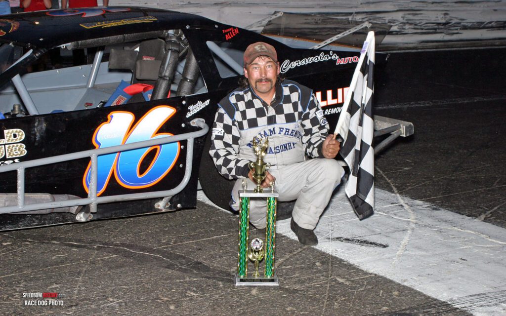 Black and white abstract pattern with concentric circles and wave shapes.