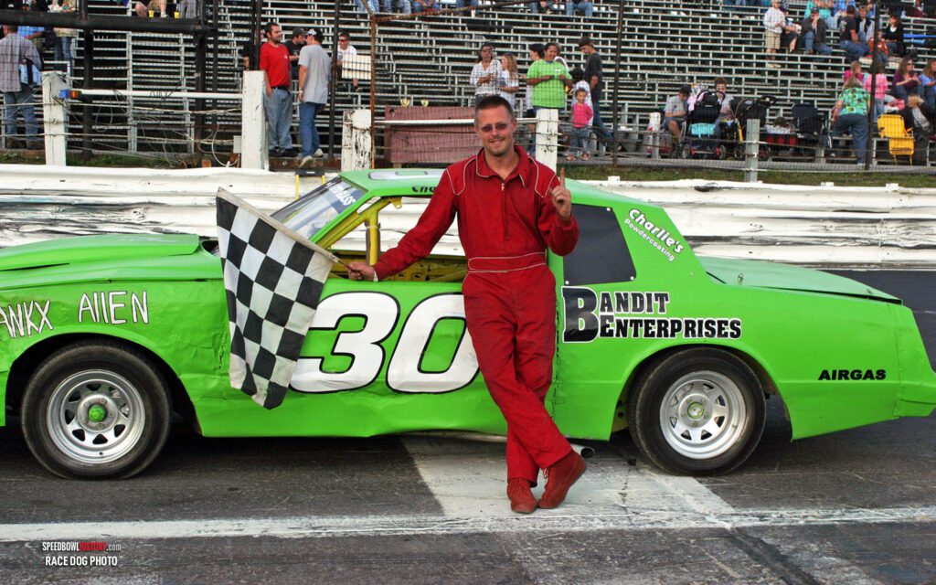 Black and white abstract pattern with concentric circles and wave shapes.