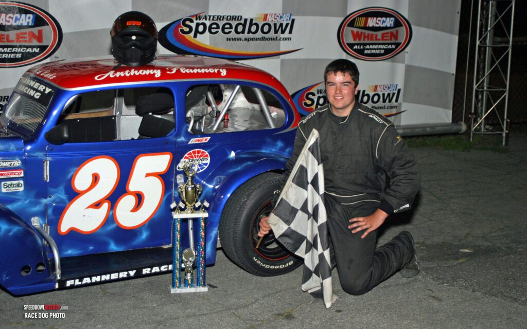 Black and white abstract pattern with concentric circles and wave shapes.