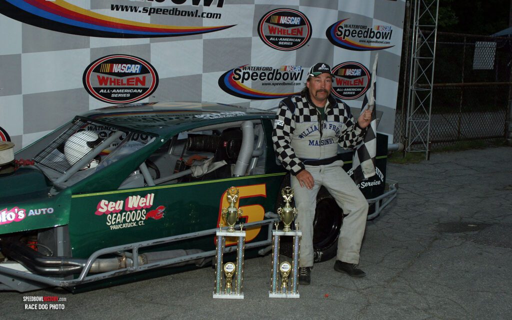 Black and white abstract pattern with concentric circles and wave shapes.