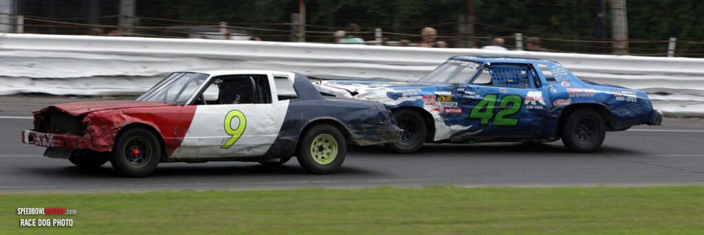 Black and white abstract pattern with concentric circles and wave shapes.