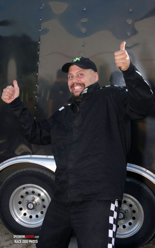 Black and white abstract pattern with concentric circles and wave shapes.