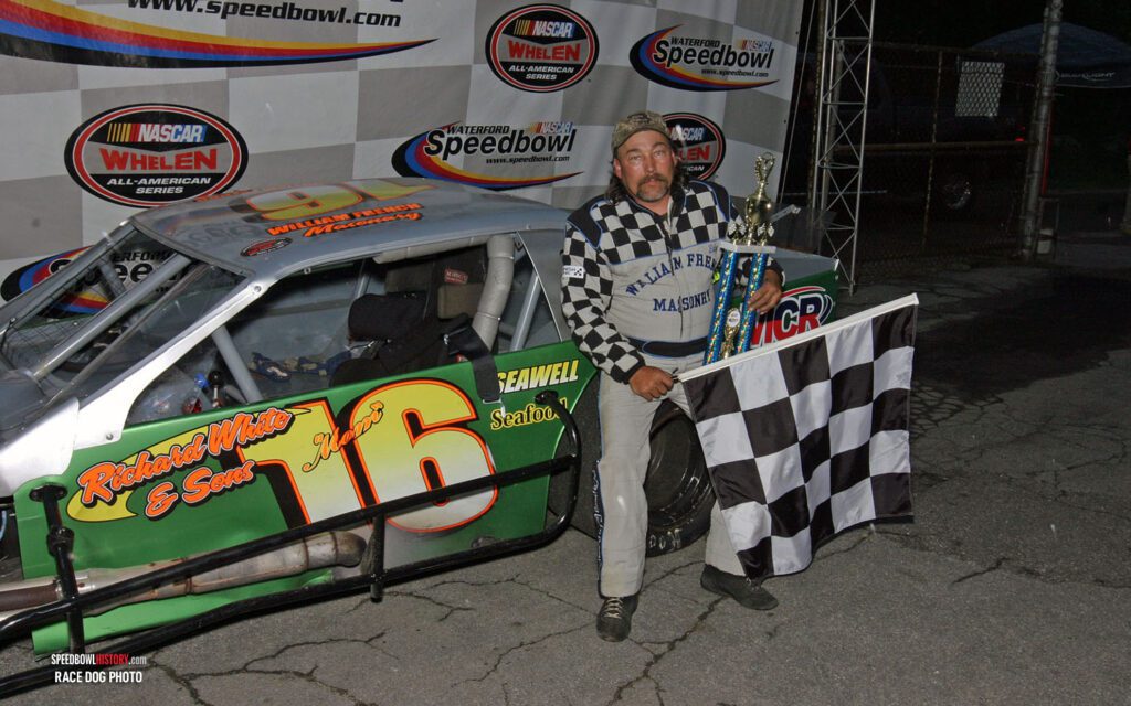 Black and white abstract pattern with concentric circles and wave shapes.