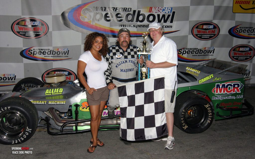 Black and white abstract pattern with concentric circles and wave shapes.