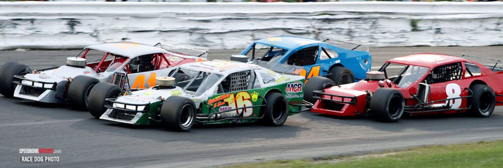 Black and white abstract pattern with concentric circles and wave shapes.