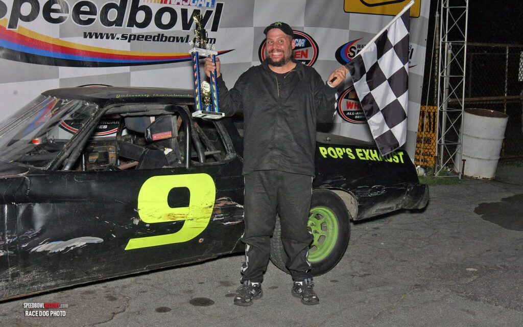 Black and white abstract pattern with concentric circles and wave shapes.