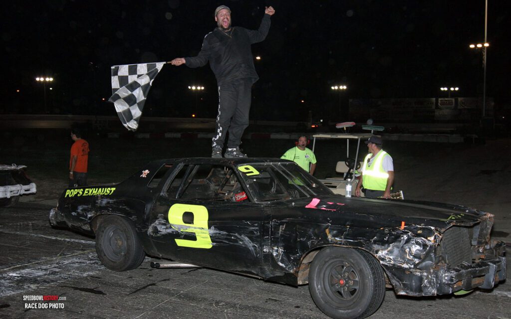 Black and white abstract pattern with concentric circles and wave shapes.