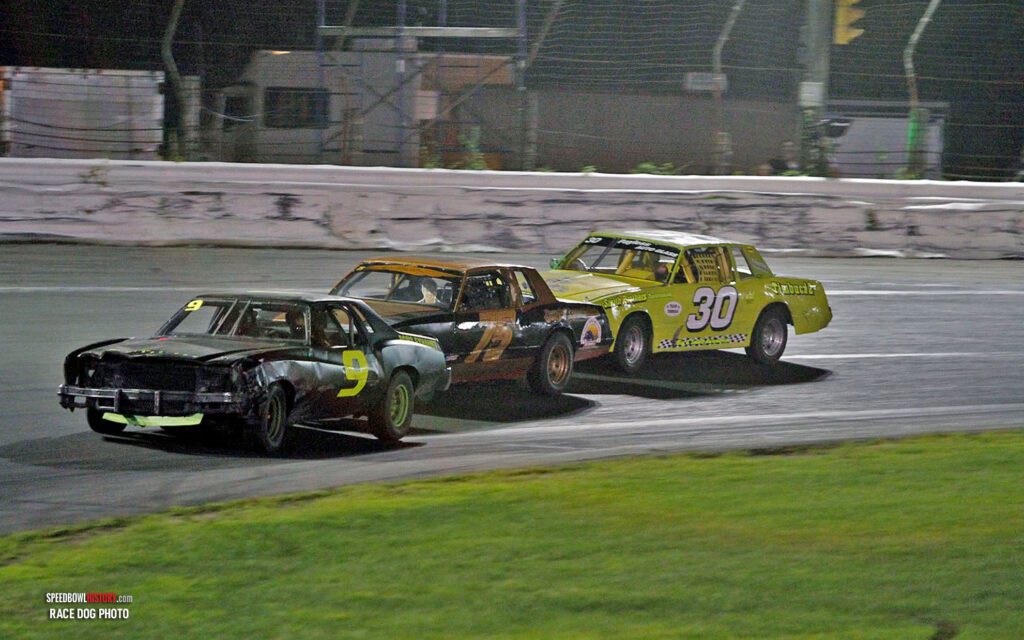 Black and white abstract pattern with concentric circles and wave shapes.