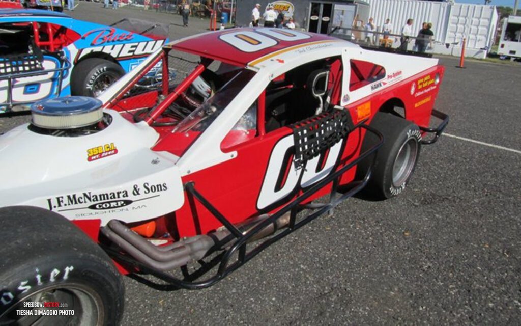 Black and white abstract pattern with concentric circles and wave shapes.