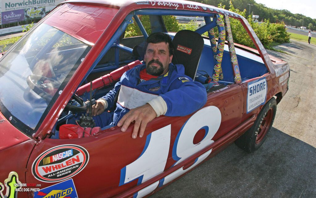 Black and white abstract pattern with concentric circles and wave shapes.