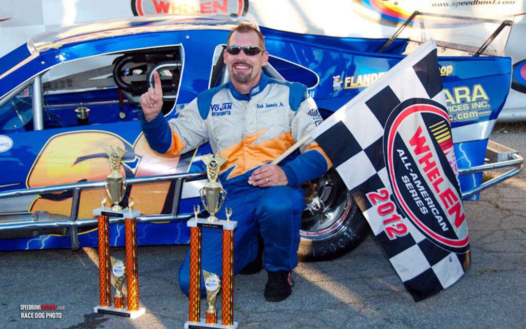 Black and white abstract pattern with concentric circles and wave shapes.