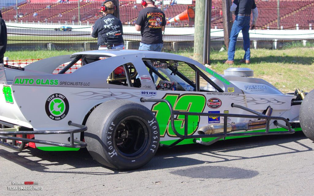 Black and white abstract pattern with concentric circles and wave shapes.