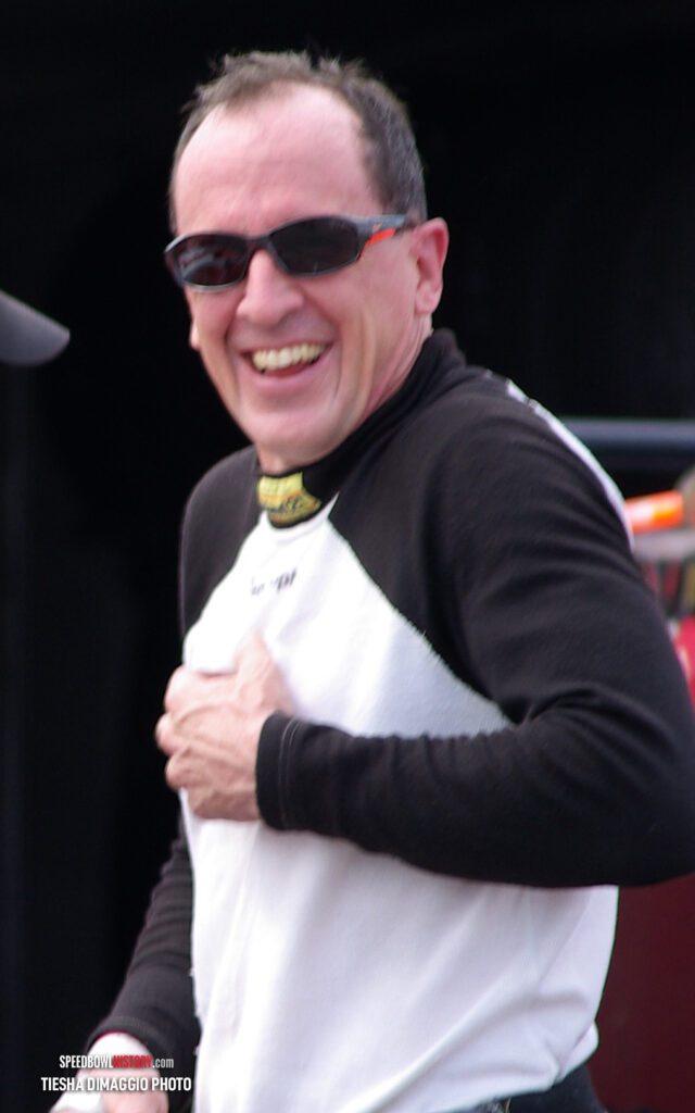 Black and white abstract pattern with concentric circles and wave shapes.