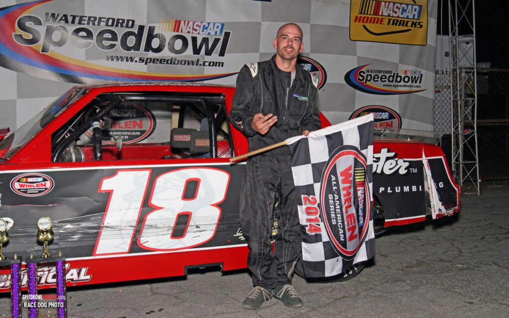 Black and white abstract pattern with concentric circles and wave shapes.