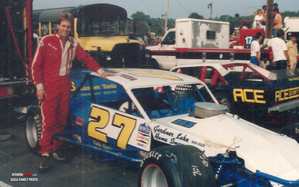 Black and white abstract pattern with concentric circles and wave shapes.