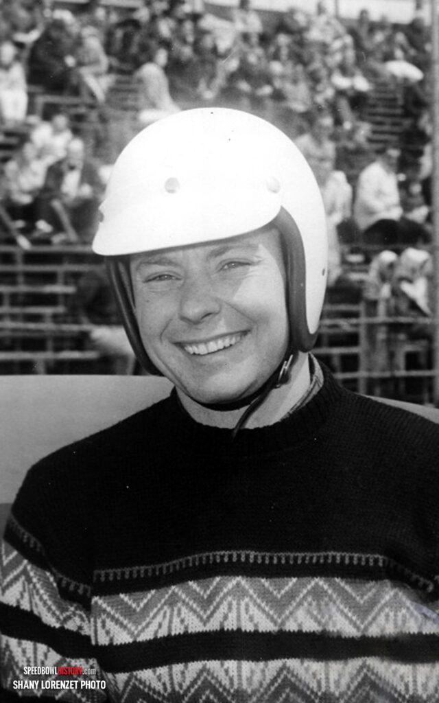 Black and white abstract pattern with concentric circles and wave shapes.