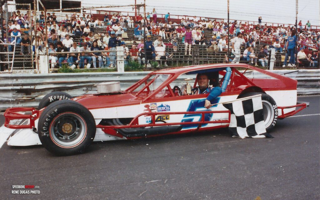 Black and white abstract pattern with concentric circles and wave shapes.