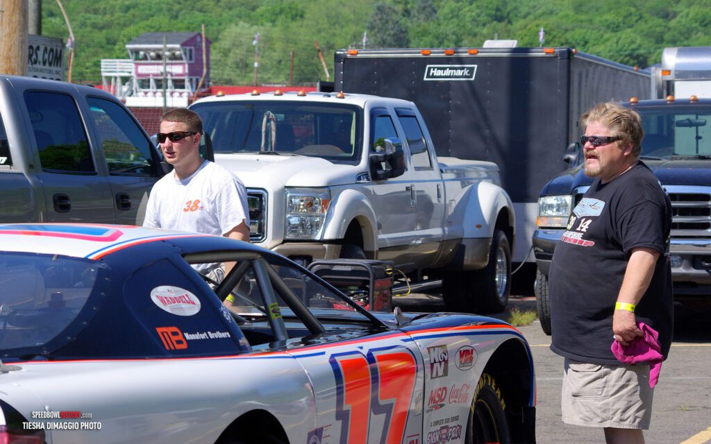 Black and white abstract pattern with concentric circles and wave shapes.