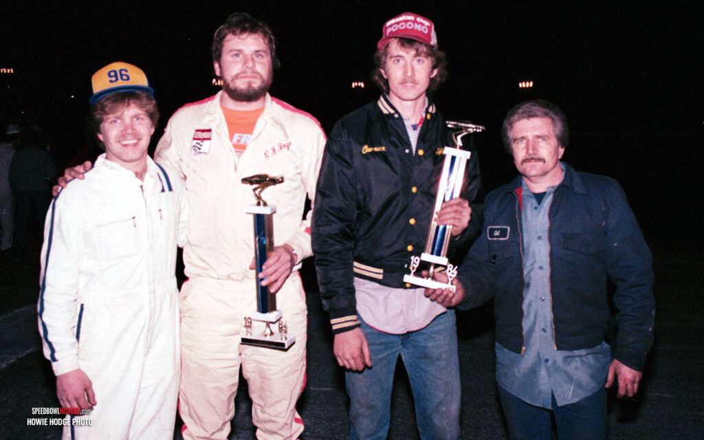 Black and white abstract pattern with concentric circles and wave shapes.