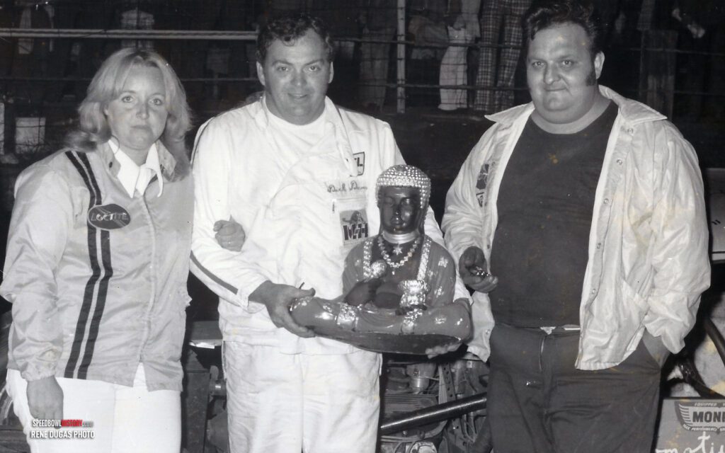 Black and white abstract pattern with concentric circles and wave shapes.