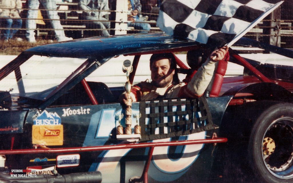 Black and white abstract pattern with concentric circles and wave shapes.