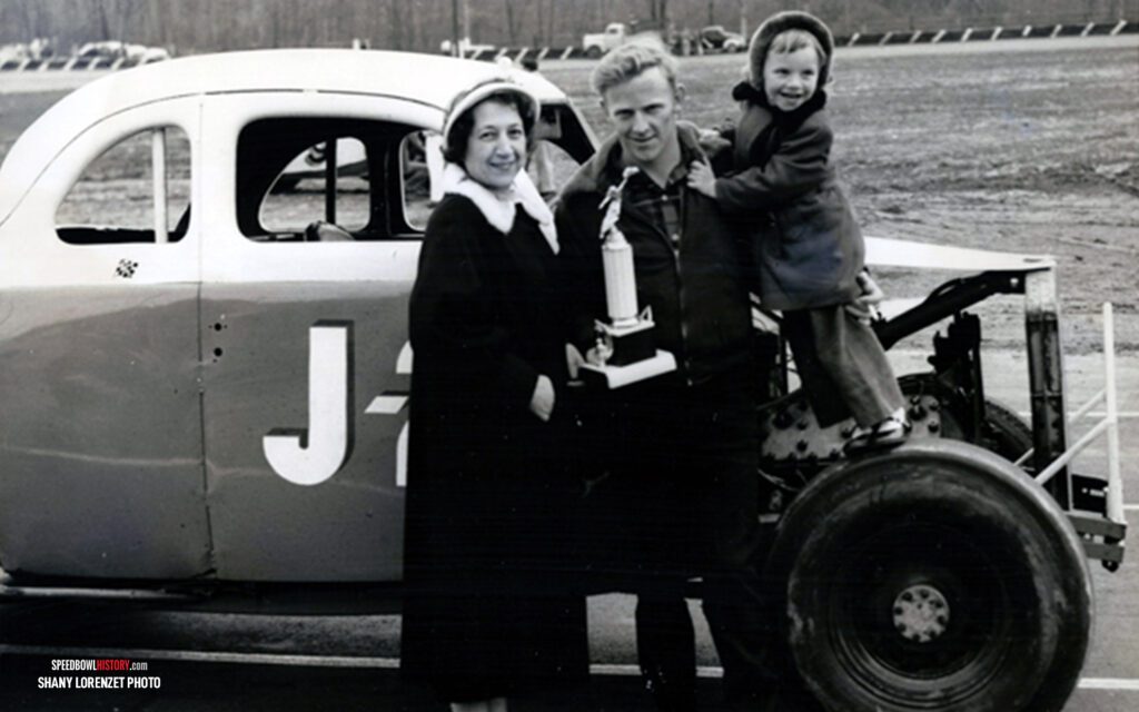 Black and white abstract pattern with concentric circles and wave shapes.